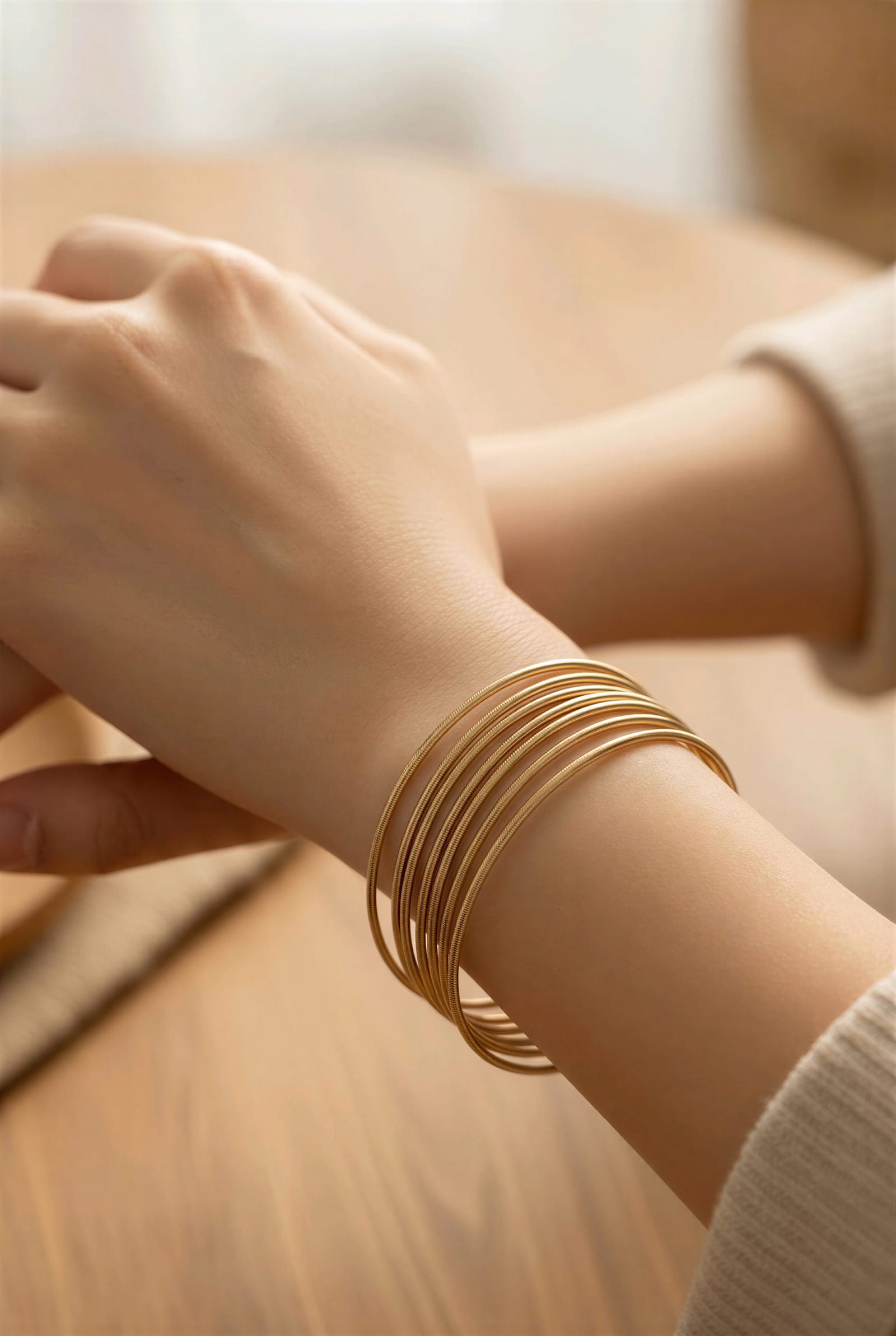 Stainless steel stacking bangles worn on the wrist